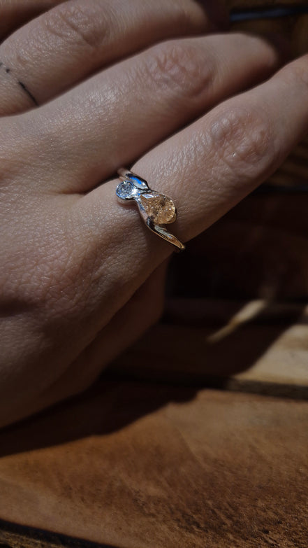Twist of Fate Wave Ring – A Dance of Light and Fate